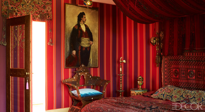 Bohemian red and purple guestroom dressed in Indian cashmere.
