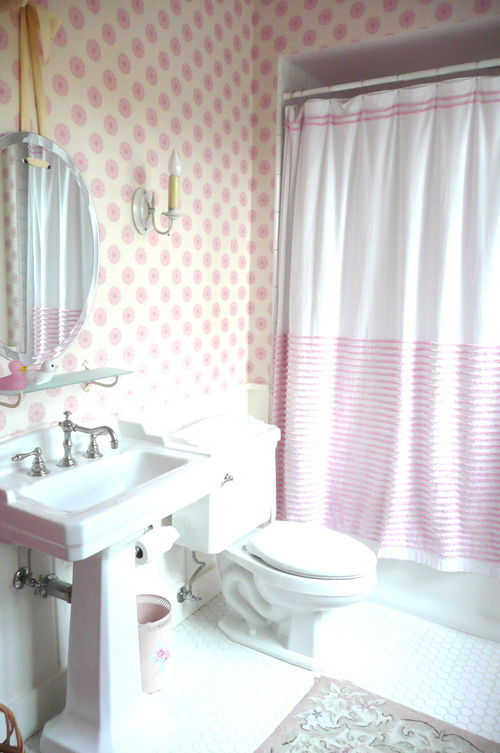 Bathroom in light pink and white.
