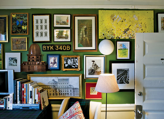 green walls packed with pictures
