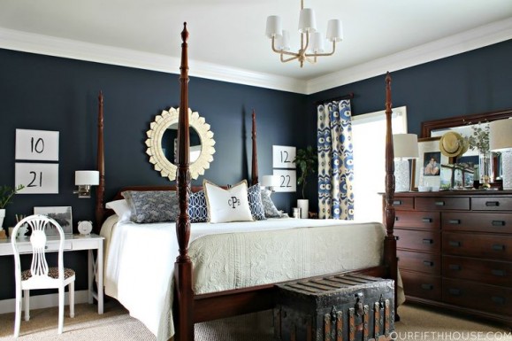 bedroom the dark wood, navy blue walls, with all the white