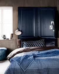 indigo blue bedroom, doors as headboard