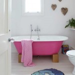 bathroom with pink bathtub