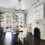 antlers on walls dark wooden floorboards dining room with fireplace