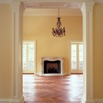 herringbone floors, fireplace and yellow walls